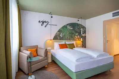 Ein Bett oder Betten in einem Zimmer der Unterkunft The Weekend Hotel