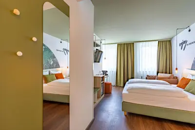 Ein Bett oder Betten in einem Zimmer der Unterkunft The Weekend Hotel