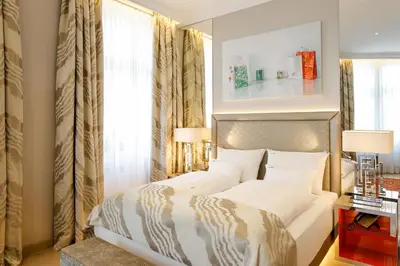 Ein Bett oder Betten in einem Zimmer der Unterkunft Boutiquehotel Das Tyrol