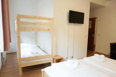Ein Bett oder Betten in einem Zimmer der Unterkunft Hotel Kaffeemühle