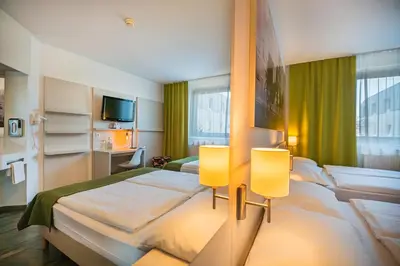 Ein Bett oder Betten in einem Zimmer der Unterkunft LifeHotel Vienna Airport