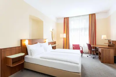 Ein Bett oder Betten in einem Zimmer der Unterkunft NH Wien Belvedere