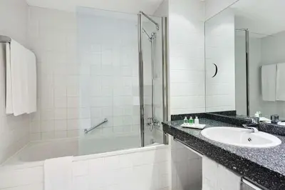 Ein Badezimmer in der Unterkunft NH Wien City