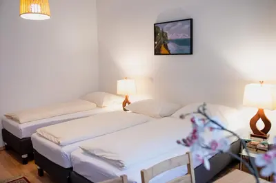 Ein Bett oder Betten in einem Zimmer der Unterkunft Pension Hotel Mariahilf