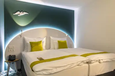 Ein Bett oder Betten in einem Zimmer der Unterkunft ARCOTEL Donauzentrum Wien
