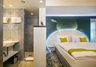 Ein Bett oder Betten in einem Zimmer der Unterkunft ARCOTEL Donauzentrum Wien
