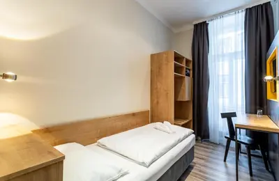 Ein Bett oder Betten in einem Zimmer der Unterkunft Hotel Westbahn