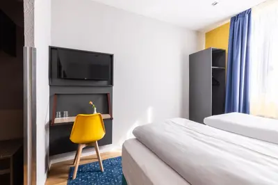 Ein Bett oder Betten in einem Zimmer der Unterkunft Garner Hotel Vienna by IHG