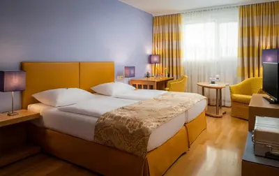Ein Bett oder Betten in einem Zimmer der Unterkunft Appartement-Hotel an der Riemergasse