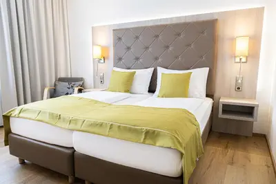 Ein Bett oder Betten in einem Zimmer der Unterkunft Das Reinisch Hotel - near Vienna Airport