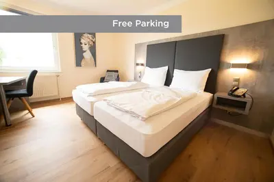 Ein Bett oder Betten in einem Zimmer der Unterkunft Das Reinisch Just Rooms