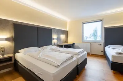 Ein Bett oder Betten in einem Zimmer der Unterkunft Das Reinisch Just Rooms