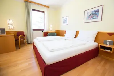 Ein Bett oder Betten in einem Zimmer der Unterkunft Das Reinisch Just Rooms