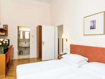 Ein Bett oder Betten in einem Zimmer der Unterkunft Hotel Johann Strauss