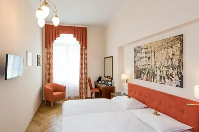 Ein Bett oder Betten in einem Zimmer der Unterkunft Hotel Johann Strauss