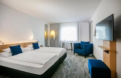 Ein Bett oder Betten in einem Zimmer der Unterkunft ARCOTEL Wimberger Wien