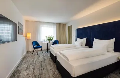 Ein Bett oder Betten in einem Zimmer der Unterkunft ARCOTEL Wimberger Wien