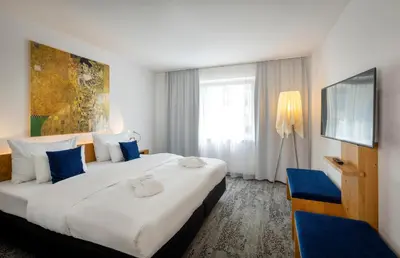 Ein Bett oder Betten in einem Zimmer der Unterkunft ARCOTEL Wimberger Wien