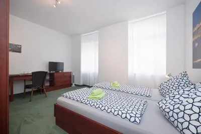 Ein Bett oder Betten in einem Zimmer der Unterkunft Pension San Francisco