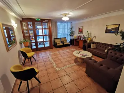 Ein Sitzbereich in der Unterkunft Hotel Bajazzo