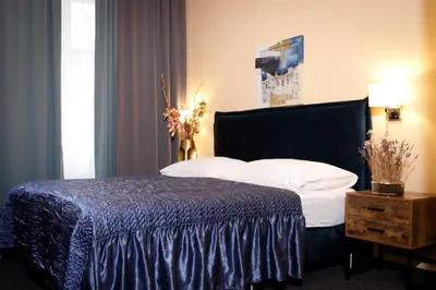 Ein Bett oder Betten in einem Zimmer der Unterkunft Hotel Bajazzo