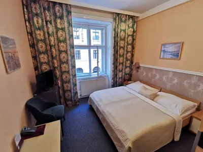 Ein Bett oder Betten in einem Zimmer der Unterkunft Hotel Bajazzo