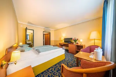 Ein Bett oder Betten in einem Zimmer der Unterkunft Hotel Bellevue Wien
