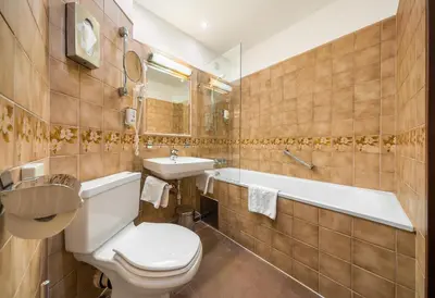 Ein Badezimmer in der Unterkunft Hotel Bellevue Wien