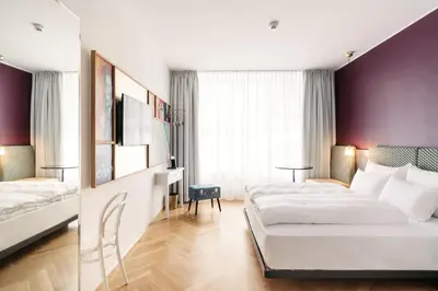 Ein Bett oder Betten in einem Zimmer der Unterkunft Hotel Schani Salon
