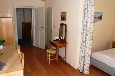 Ein Bett oder Betten in einem Zimmer der Unterkunft Hotel Graf Stadion