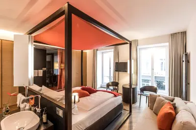 Ein Bett oder Betten in einem Zimmer der Unterkunft Buxbaum Beletage Design & Boutique Hotel