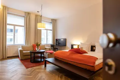 Ein Bett oder Betten in einem Zimmer der Unterkunft Buxbaum Beletage Design & Boutique Hotel