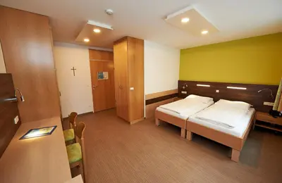 Ein Bett oder Betten in einem Zimmer der Unterkunft Hotel Kolping Wien Zentral