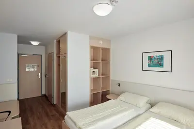 Ein Bett oder Betten in einem Zimmer der Unterkunft Hotel Kolping Wien Zentral