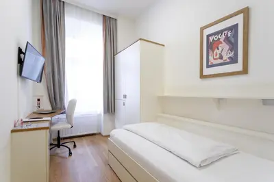 Ein Bett oder Betten in einem Zimmer der Unterkunft Riess City Rooms - Self Check-in