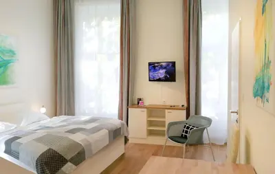 Ein Bett oder Betten in einem Zimmer der Unterkunft Riess City Rooms - Self Check-in