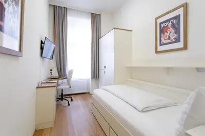 Ein Bett oder Betten in einem Zimmer der Unterkunft Riess City Rooms - Self Check-in
