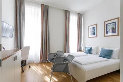 Ein Bett oder Betten in einem Zimmer der Unterkunft Riess City Rooms - Self Check-in