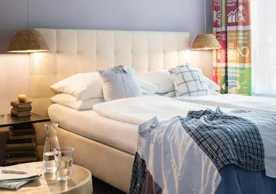 Ein Bett oder Betten in einem Zimmer der Unterkunft Boutiquehotel Stadthalle by Cocoon