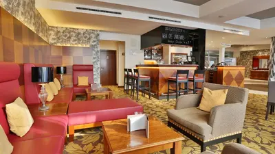 Ein Sitzbereich in der Unterkunft Hotel Am Parkring