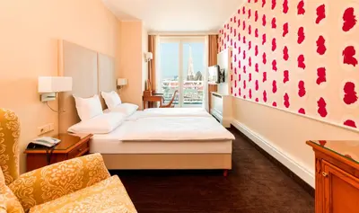 Ein Bett oder Betten in einem Zimmer der Unterkunft Hotel Am Parkring