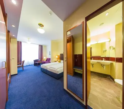 Ein Bett oder Betten in einem Zimmer der Unterkunft Austria Classic Hotel Wien