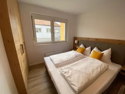 Ein Bett oder Betten in einem Zimmer der Unterkunft Apartments Freitag - H1