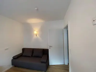 Ein Sitzbereich in der Unterkunft Apartments Freitag - H1