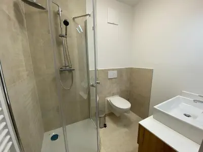 Ein Badezimmer in der Unterkunft Apartments Freitag - H1