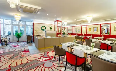 Ein Restaurant oder anderes Speiselokal in der Unterkunft Theaterhotel & Suites Wien