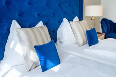 Ein Bett oder Betten in einem Zimmer der Unterkunft Theaterhotel & Suites Wien
