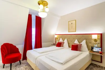 Ein Bett oder Betten in einem Zimmer der Unterkunft Theaterhotel & Suites Wien