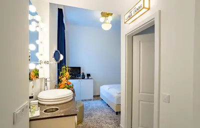 Ein Bett oder Betten in einem Zimmer der Unterkunft Theaterhotel & Suites Wien