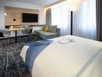 Ein Bett oder Betten in einem Zimmer der Unterkunft Novotel Suites Wien City Donau
